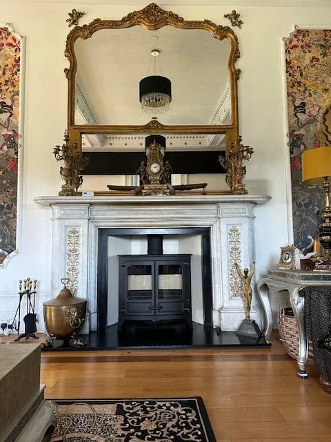 Stove in an ornate white marble fireplace by Agnew Chimney Engineering Glasgow
